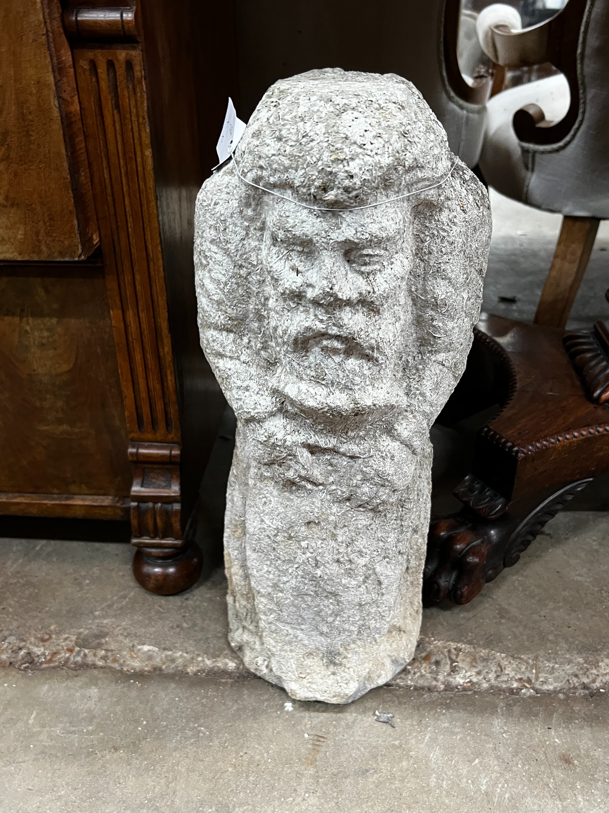 Two medieval style carved stone corbels, height 48cm